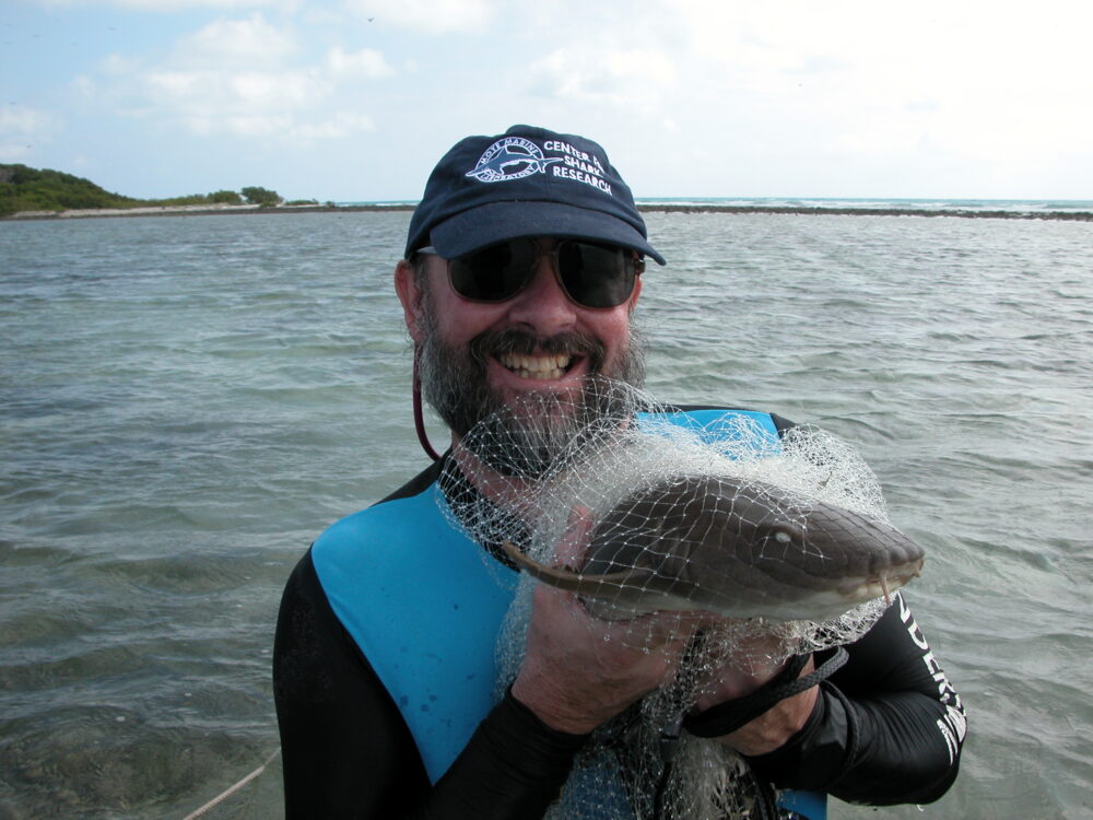 Jeff holding nurse shark in net